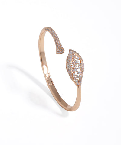 Rose gold bracelet with diamond accents on a white background