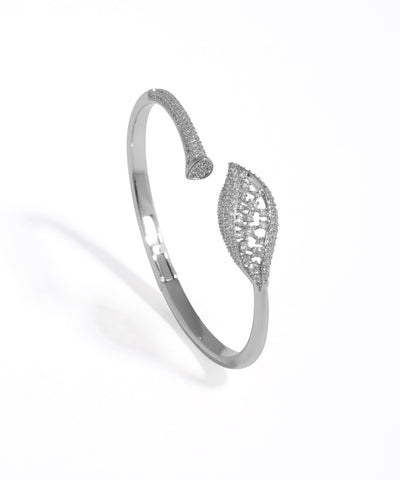 Silver bracelet with intricate design on a white background