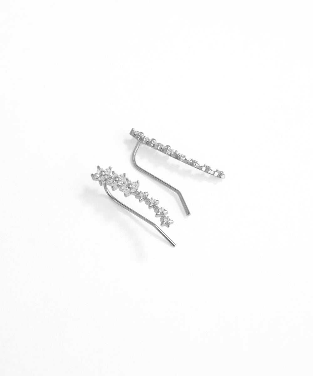 Silver hair clip with floral design on a white background