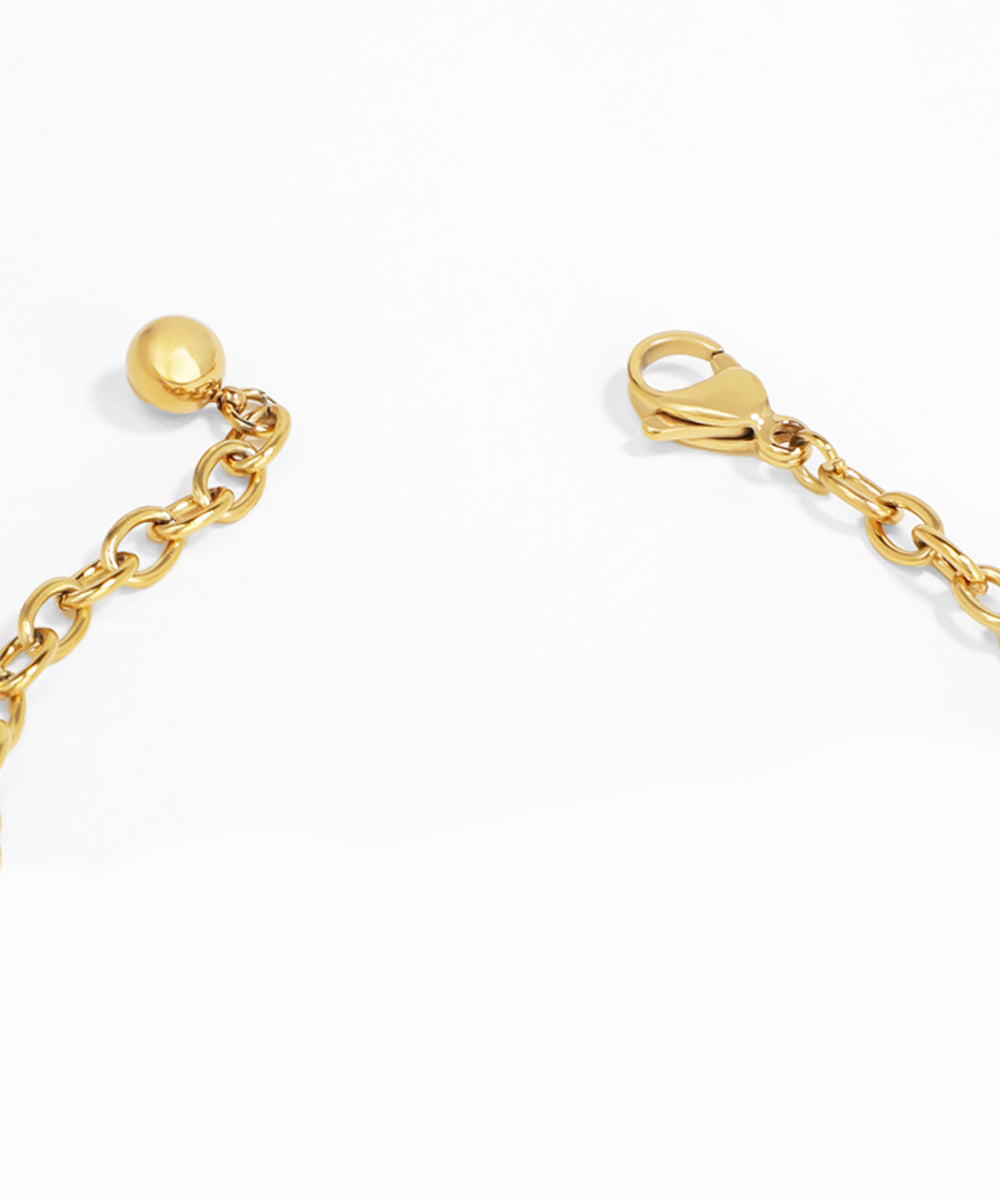 Gold chain with a clasp on a white background