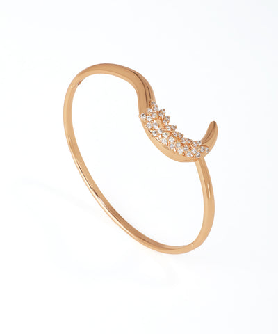 Rose gold bracelet with diamond accents on a white background