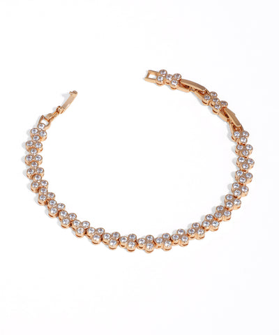 Rose-gold-tone bracelet with continuous clusters of clear cubic zirconia stones and a box clasp closure.