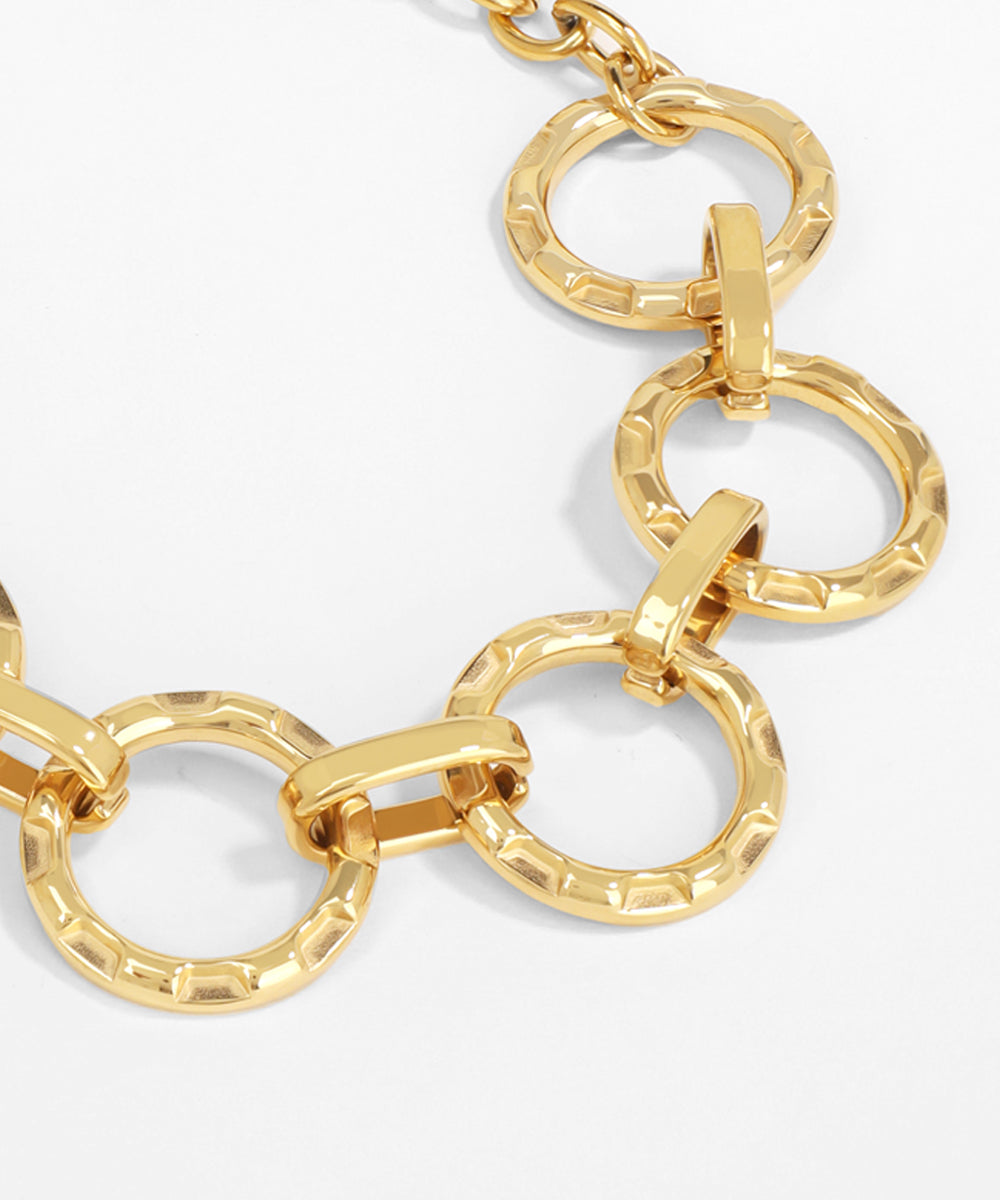 Gold chain necklace on a white background