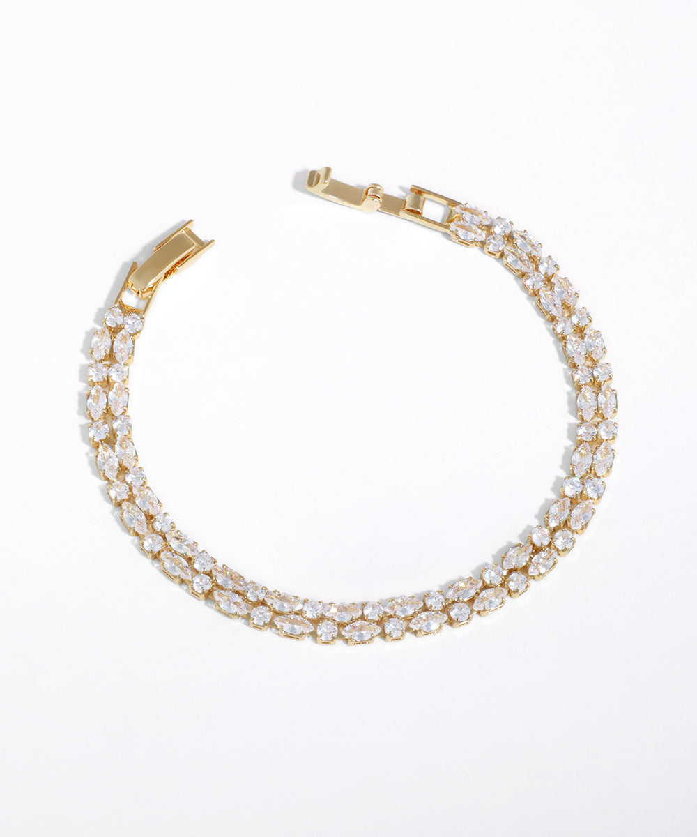 Gold-tone bracelet with two rows of brilliant marquise cubic zirconia stones and a sleek box clasp