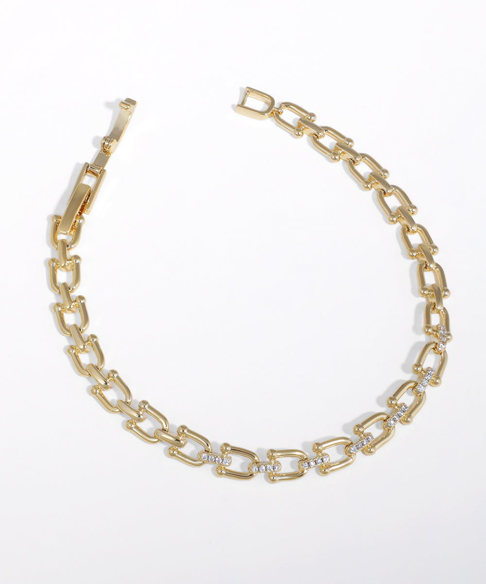 Gold-tone U-link chain bracelet with clear stone accents