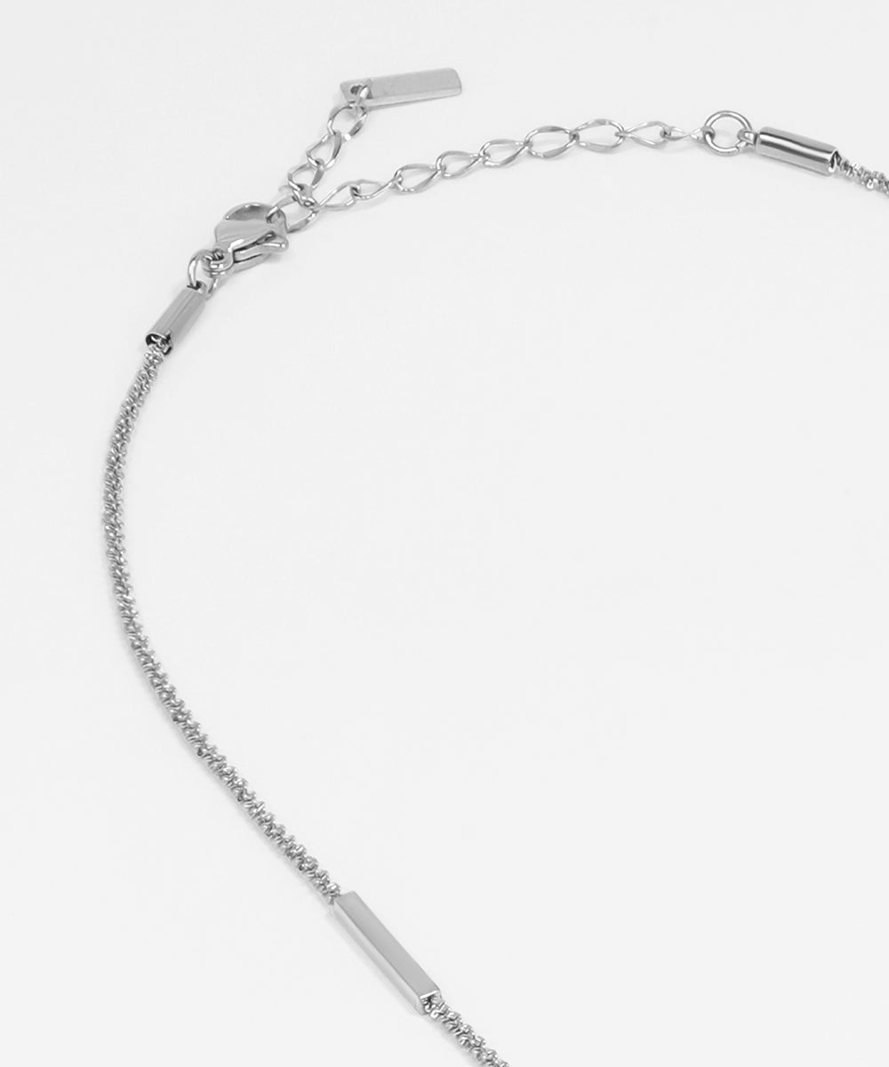 Silver bracelet with chain design on a white background