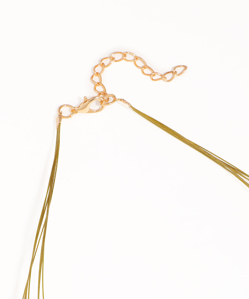Gold necklace with a clasp on a white background