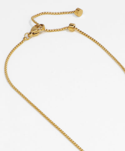 Gold bracelet on a white background