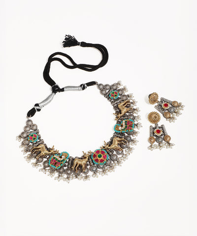 Oxidised silver-tone necklace set with gold-tone deer motifs, colorful enamel, and faux pearl drops