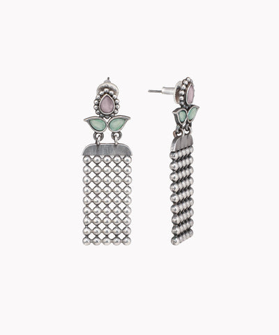 Pair of silver tassel earrings with green accents on a white background