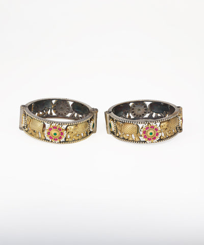 Oxidized and gold-tone bangle bracelet with elephant motifs, faux pearls, and red and green stones