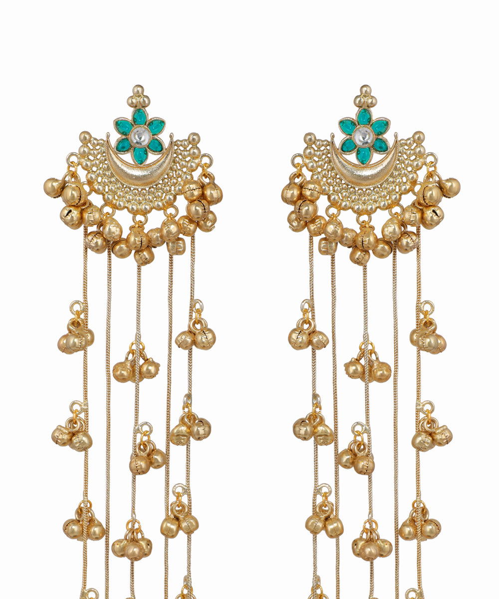 Gold earrings with pearl-like beads and turquoise stones on a white background