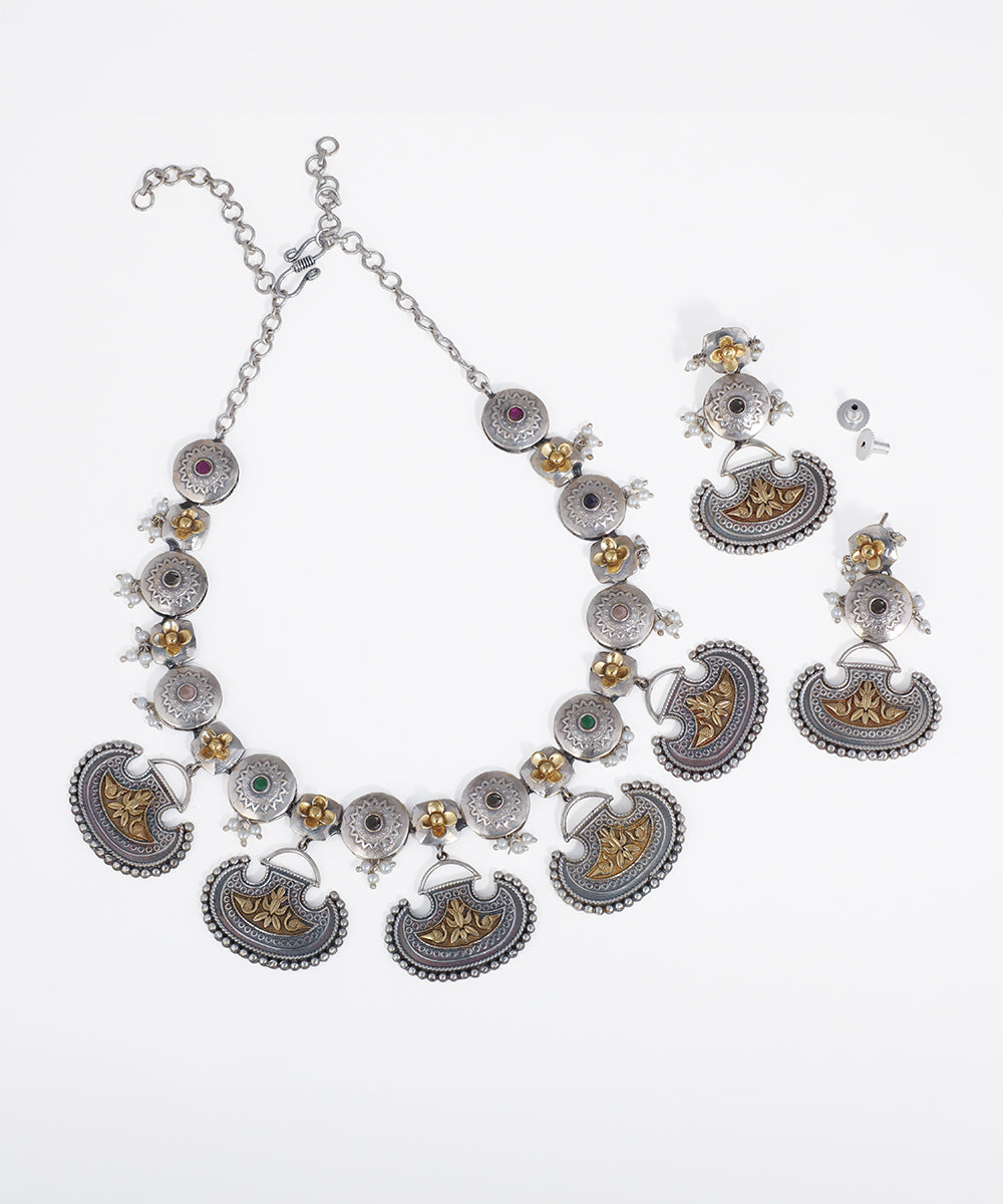 Oxidized silver-tone and gold-tone necklace set with curved ethnic drops, small flowers, and colorful embedded stones.