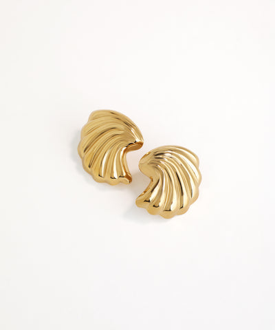 Pair of gold shell-shaped earrings on a white background