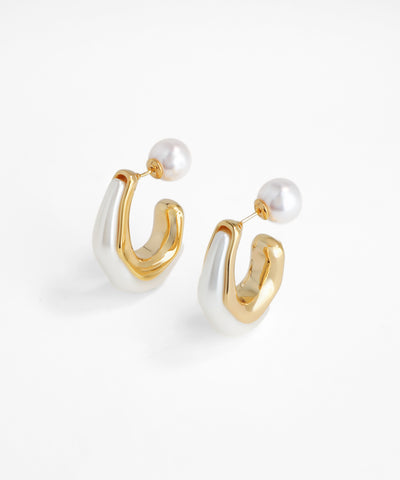 Gold and silver hoop earrings with pearls on a white background