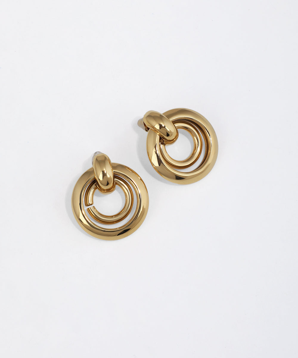 Gold-tone clip earrings with bold concentric circles design