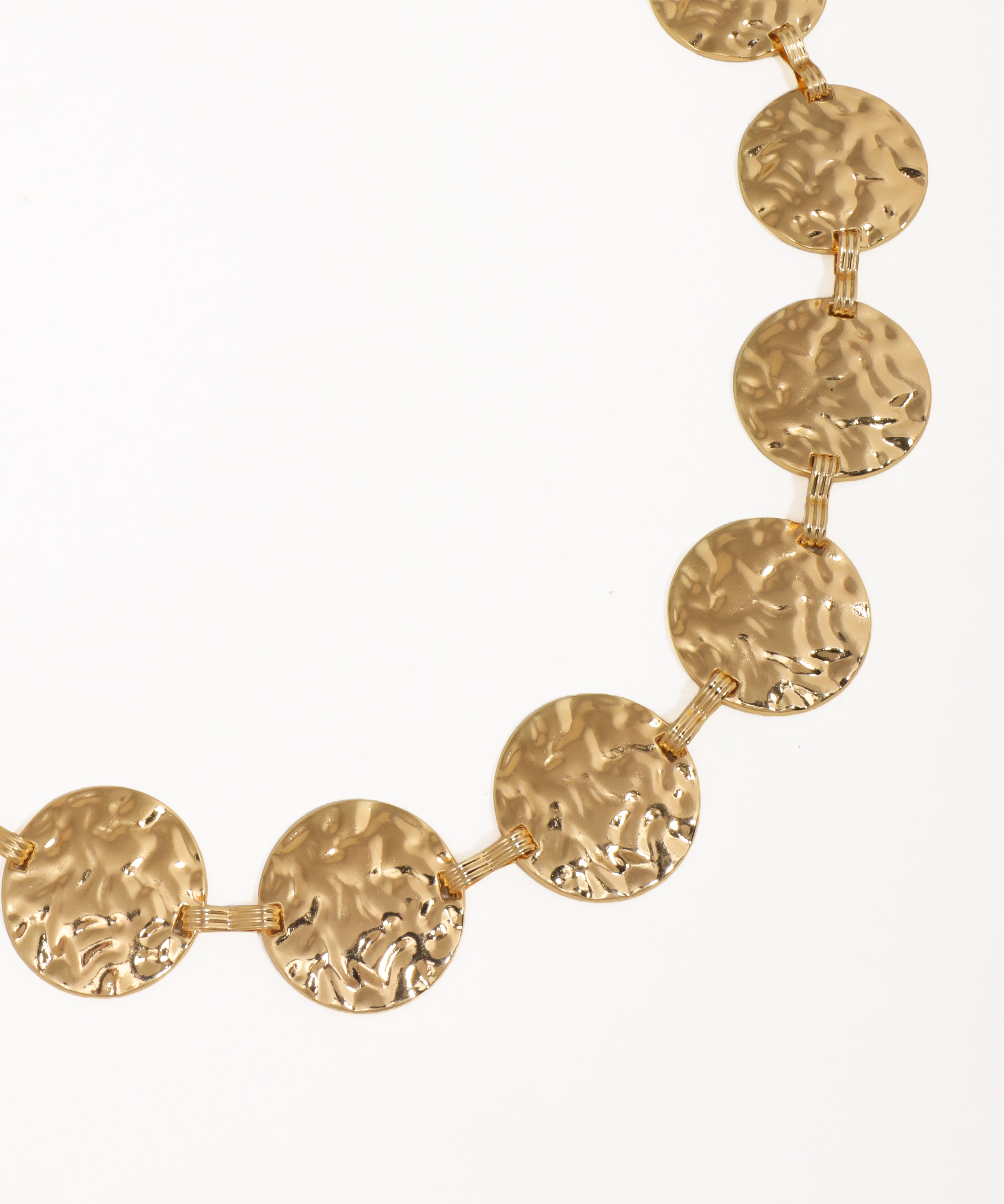 Gold necklace with small diamonds on a white background