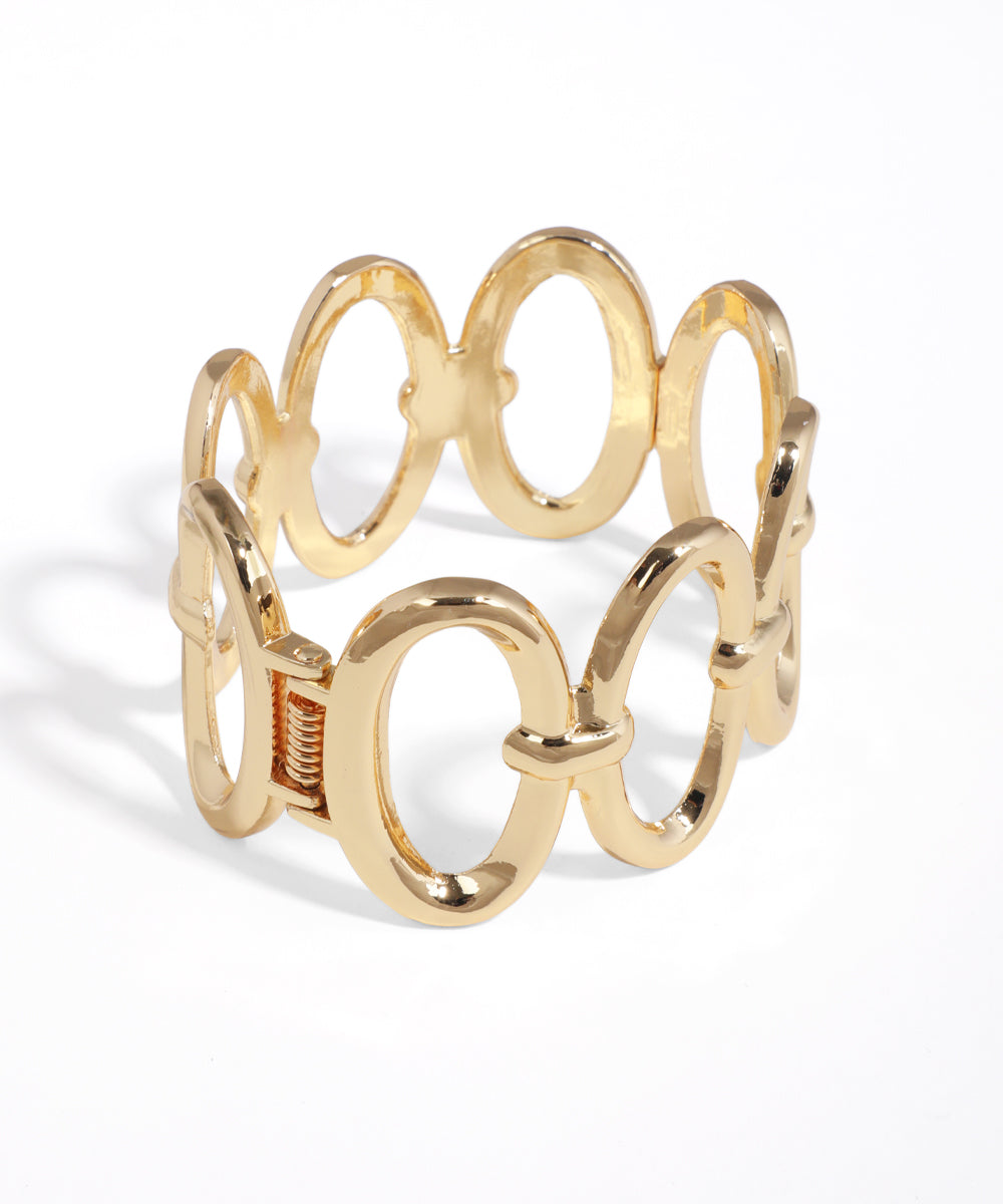 Gold bracelet with interlocking circular design on a white background