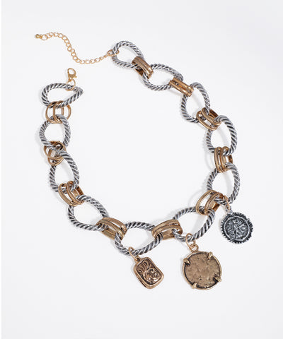 Mixed silver and gold finish necklace with twisted links and three antique-style charms.