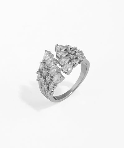 Silver ring with gold accents and a diamond on a white background