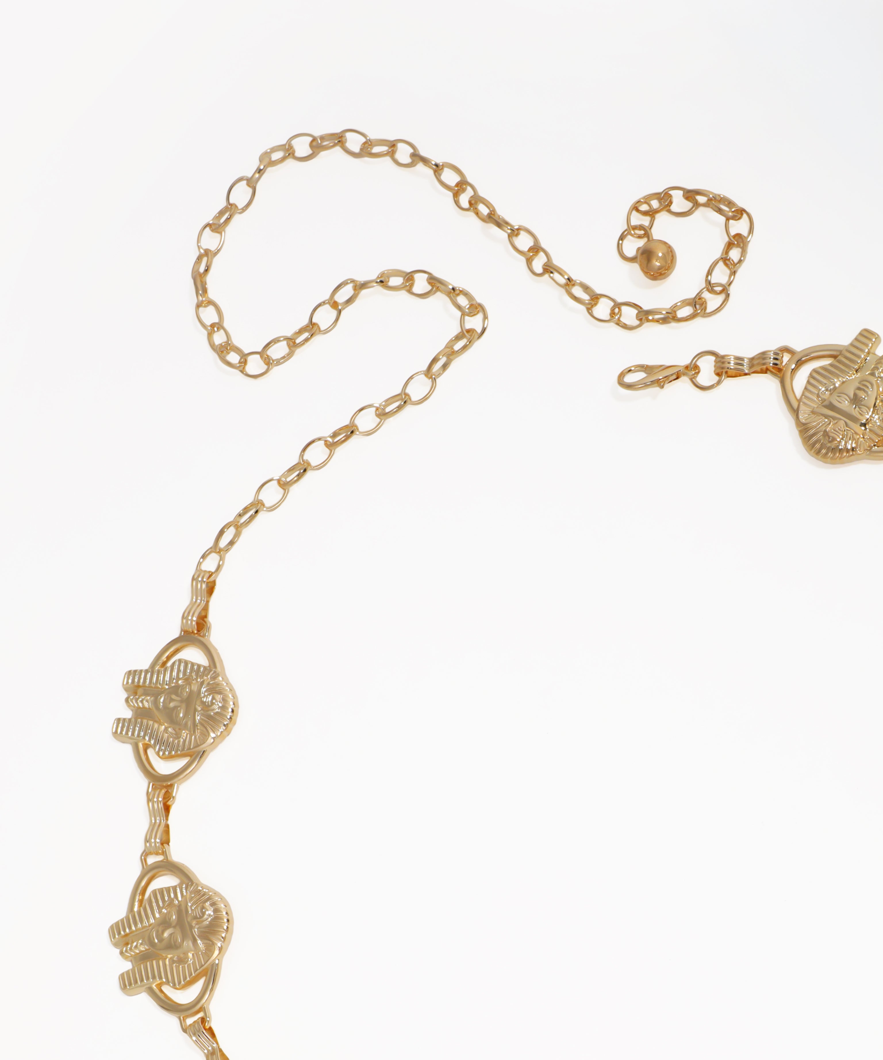 Gold chain necklace with heart-shaped pendants on a white background