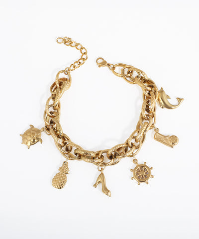 Gold-tone chunky link chain bracelet with multiple charms including a dolphin, turtle, pineapple, high heel, and ship's wheel.