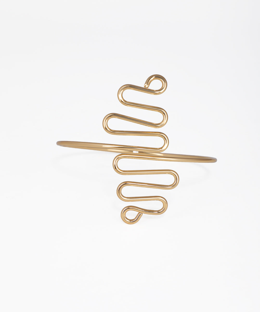 Gold spiral hair clip on a white background