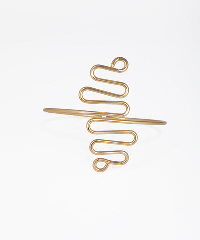 Gold spiral hair clip on a white background