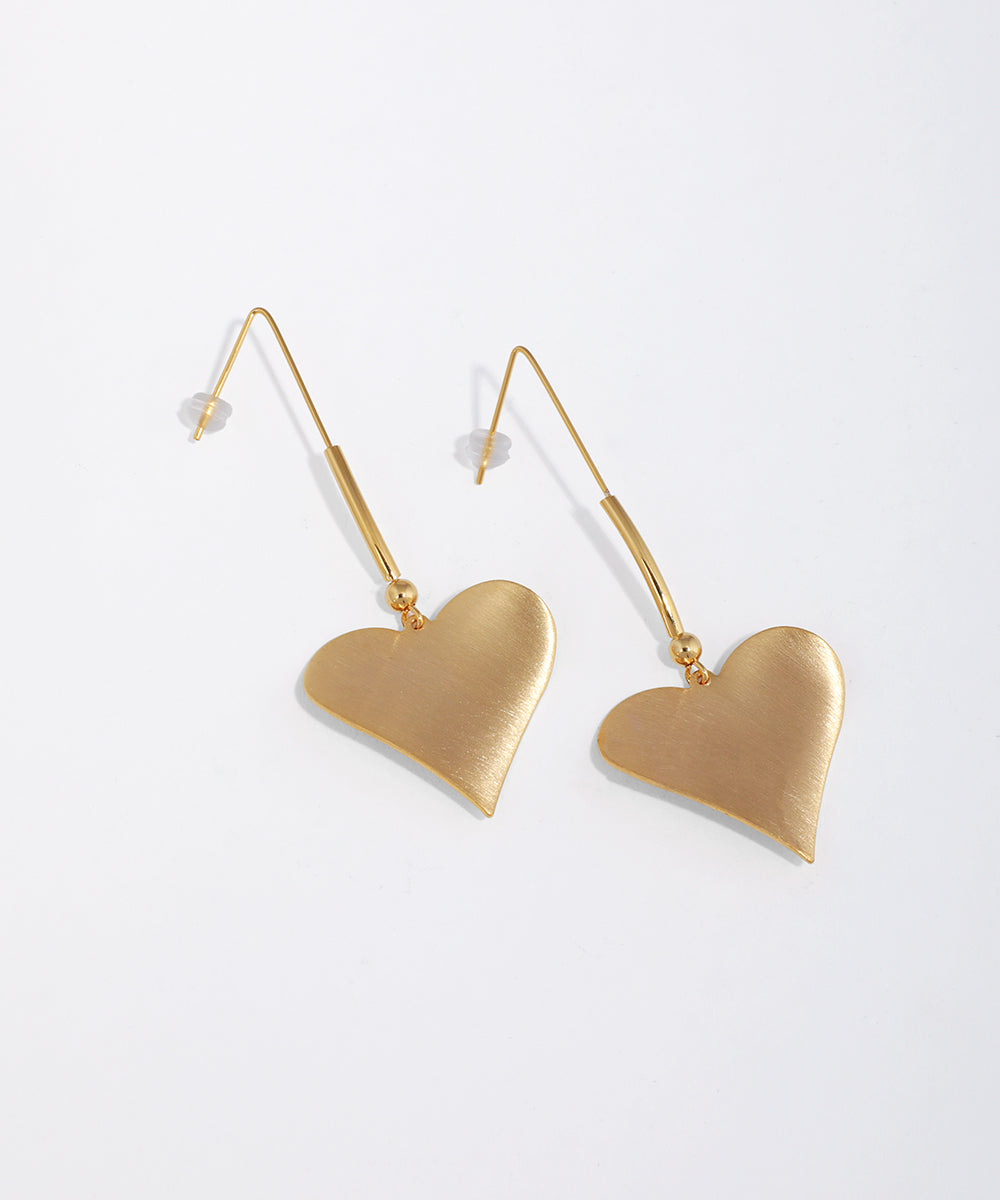 Gold-tone heart drop earrings with a brushed finish