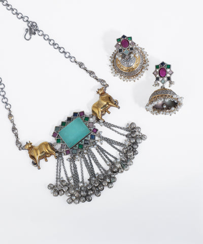 Jewelry set with necklace and earrings on a white background