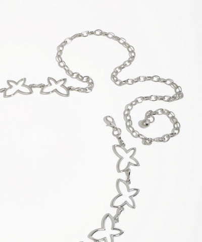 Silver butterfly-shaped necklace on a white background