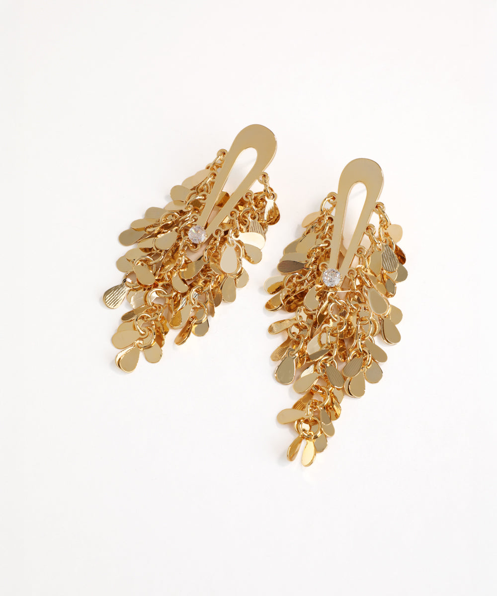 Gold chain earrings on a white background