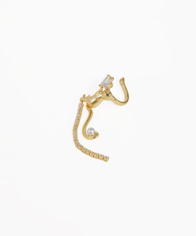 Gold cat-shaped earring on a white background