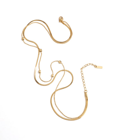 Gold necklace on a white background