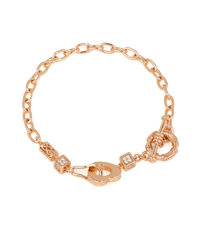 Rose-gold-tone chain link bracelet with cube CZ charms and a textured toggle clasp.