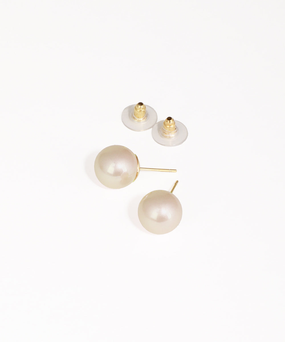 Pearl earrings with gold posts on a white background