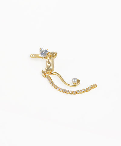 Gold-tone earring with climbing cat, heart-shaped stone, faux pearl, and a long drop of clear stones
