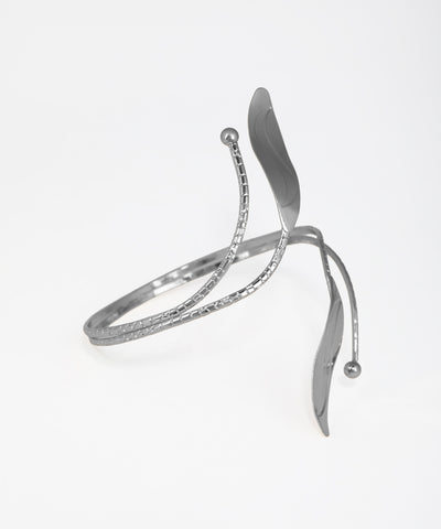 Silver bracelet with a wishbone design on a white background