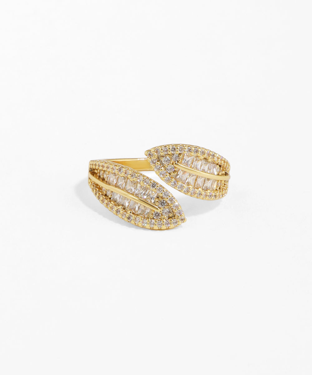 Gold ring with diamond accents on a white background