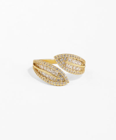 Gold ring with diamond accents on a white background