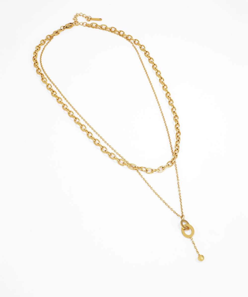 Gold chain necklace on a white background