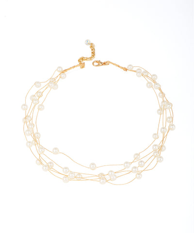 Gold-tone multi-strand necklace with floating faux pearls and an extender clasp.