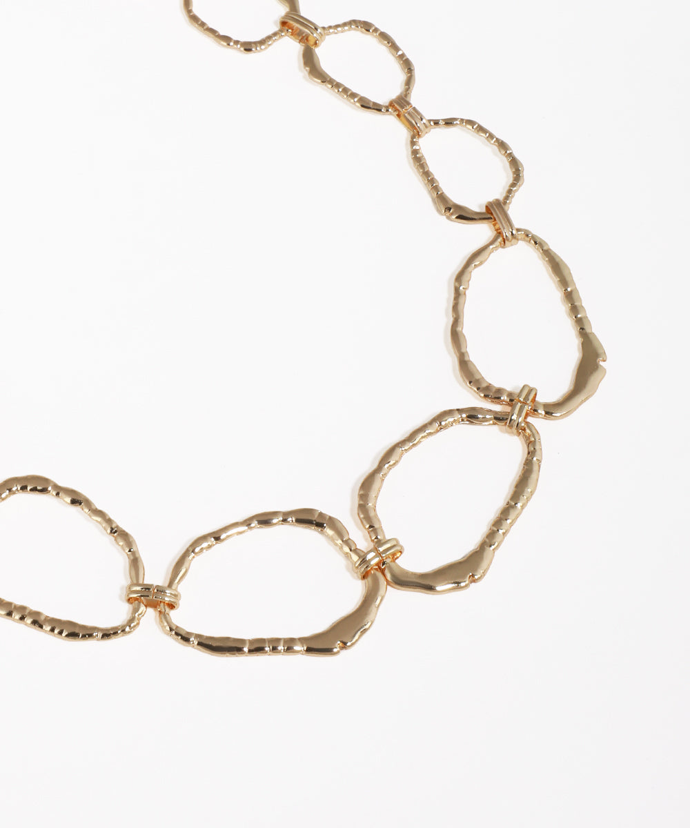 Gold chain necklace on a white background