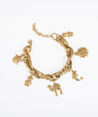 Gold-tone chain bracelet with multiple animal charms including turtle, teddy bear, camel, ladybug, and dolphin.