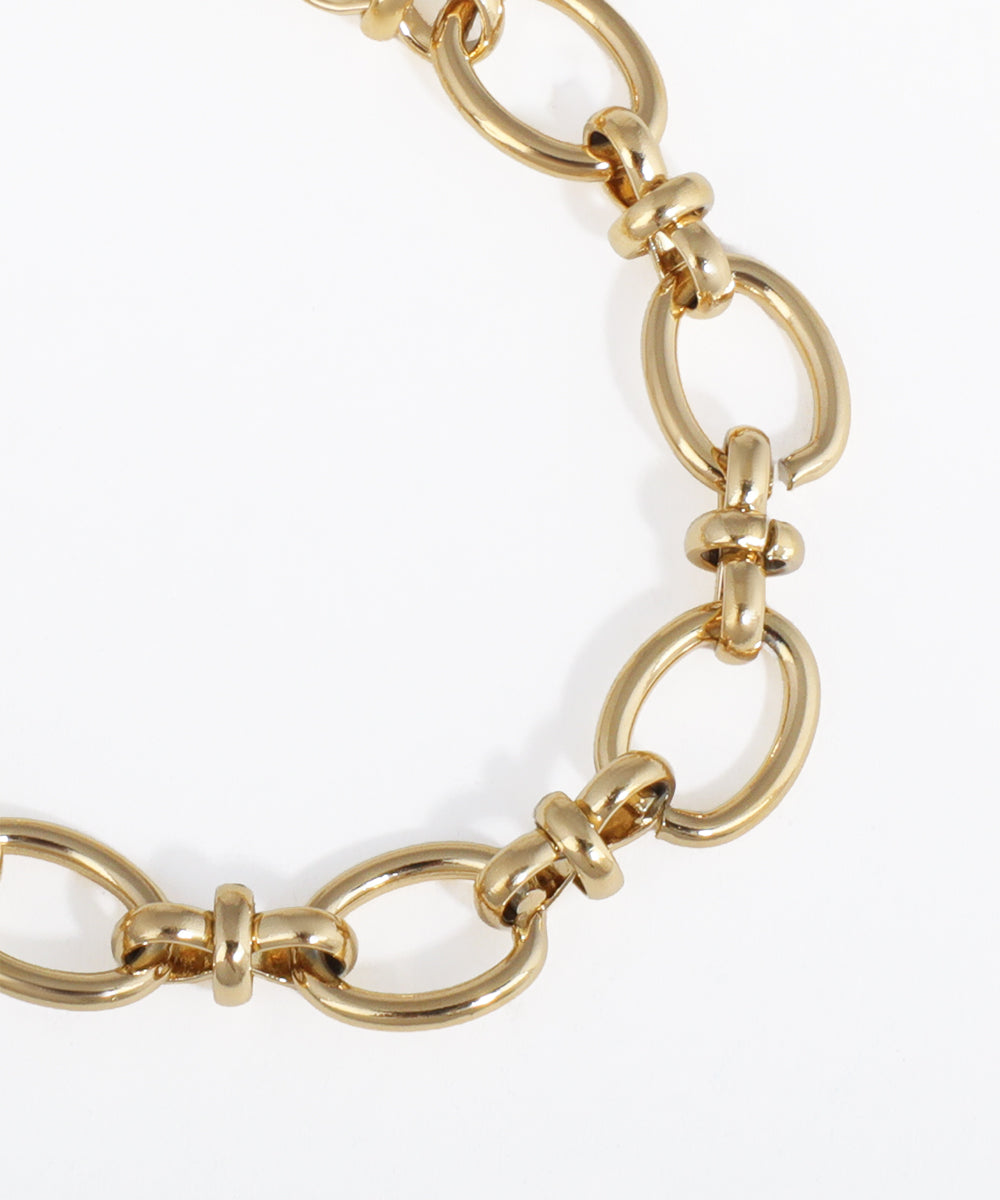 Gold chain bracelet on a white background