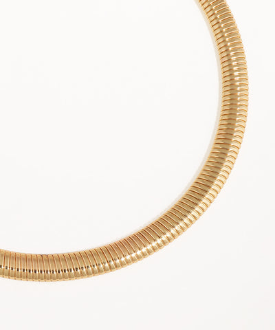 Gold necklace on a white background