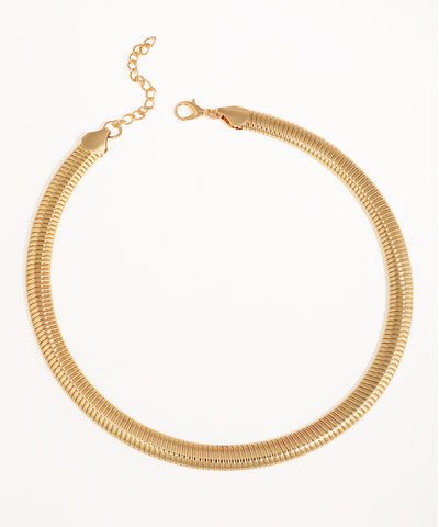 Gold-tone necklace with a wide, flexible snake chain design and lobster clasp closure