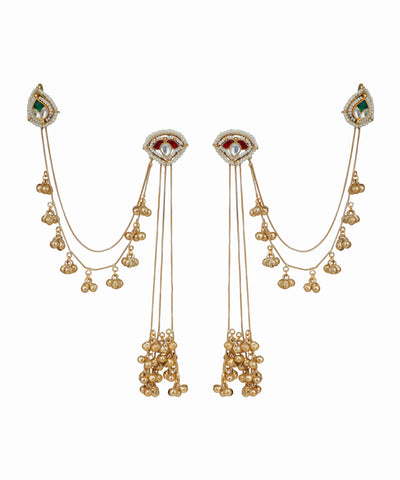 Pair of gold earrings with gemstones on a white background