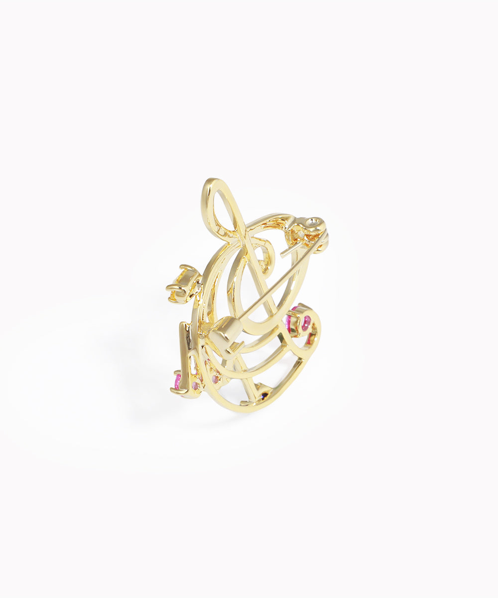 Gold ring with pink gemstones on a white background