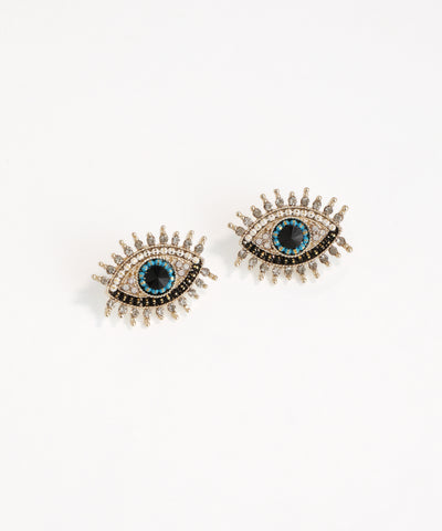Pair of eye-shaped earrings with blue gemstones on a white background